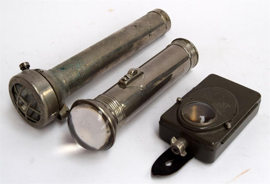 A set of three vintage torches A Pertrix Made in Germany flashlight; a wartime flashlight by Old