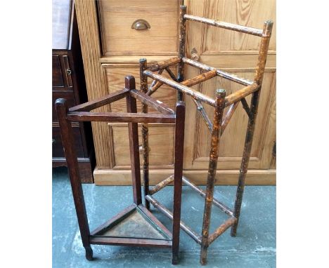 A bamboo stick stand, together with one other with metal drip tray