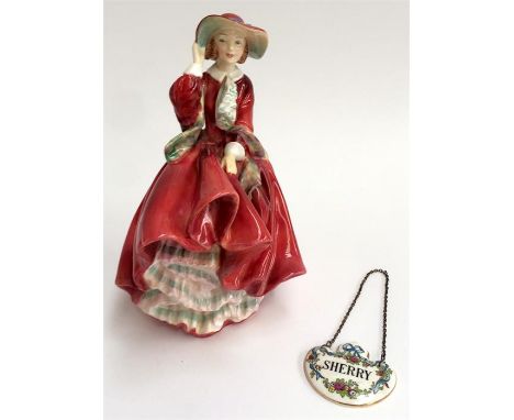 A Royal Doulton figurine 'Top o'the Hill', and a Crown Staffordshire 'Sherry' decanter badge