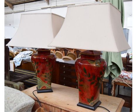 Two large ceramic table lamps on square bases, with red and green floral pattern