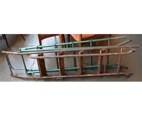 A pair of vintage metal step ladders