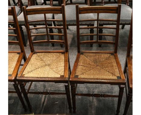 A set of seven unusual ladder back chairs with rush seats, including armchair (7)