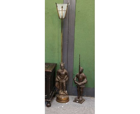 A modern knight form companion set 93cms high, togther with a similar standard lamp the base in the form of a Viking, height 