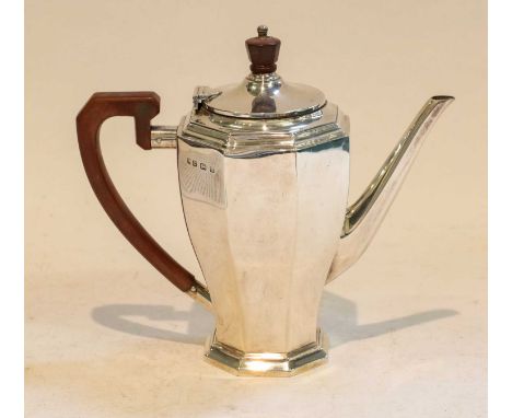 A George V Silver Coffee-Pot, by William Neale and Son Ltd., Birmingham, 1932, tapering octagonal and on conforming foot, wit