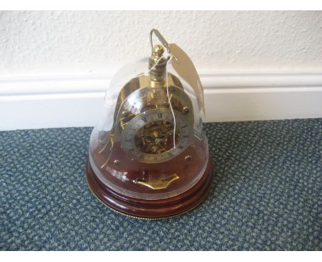 A 20th Mappin and Webb Maritime England 1982 skeleton clock striking to the glass dome, serial number 028. 