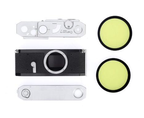 A Selection of Camera Parts for Canon, comprising a top plate for a Canon 7, VG, and a bottom plate which matches, VG, a body