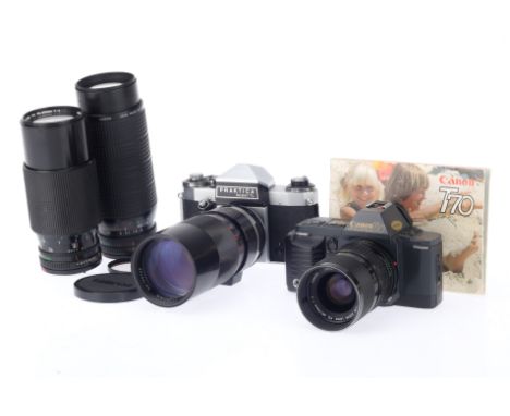 A Canon T70 35mm SLR Camera Outfit, black, serial number 1989010, body G, battery tested, shutter works, viewfinder internal 
