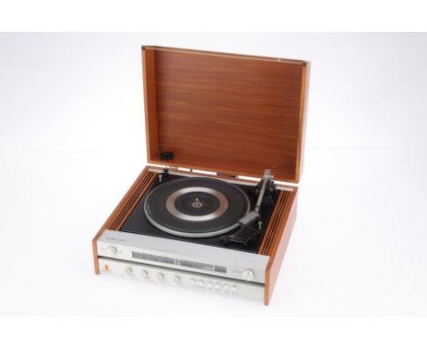 A Fidelity U.A.I. Record Player / Tuner / Amplifier Combo, in G condition, powers on &amp; spins up when connected to power, 