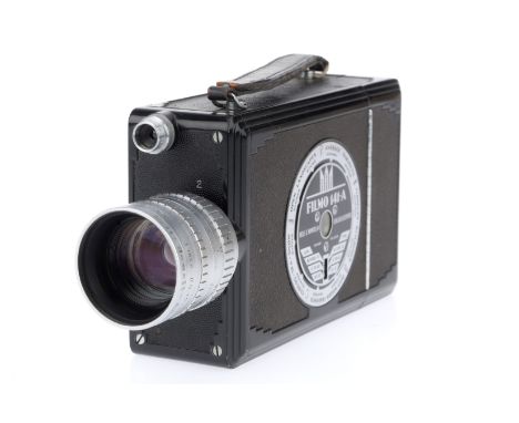 A Bell &amp; Howell Filmo 141-A Cine Camera, black, body G, motor runs, spring winds, with an Angenieux f/.95 1 inch lens, ba