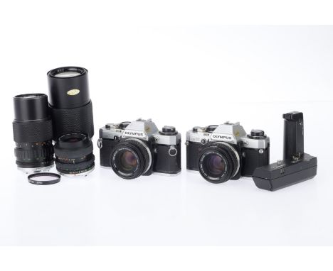 A Pair of Olympus OM-10 35mm Cameras, comprising, silver, serial number 977740, body G, shutter working, appears to meter cor