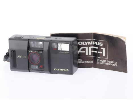 An Olympus AF-1 Compact Camera, grey, body G, light marks to base, battery tested, shutter fires and advances, flash works, s