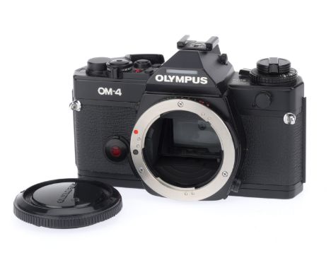 An Olympus OM-4 Camera Body, black, serial number 1004048, body G, would be VG but small dents to bottom plate, shutter works