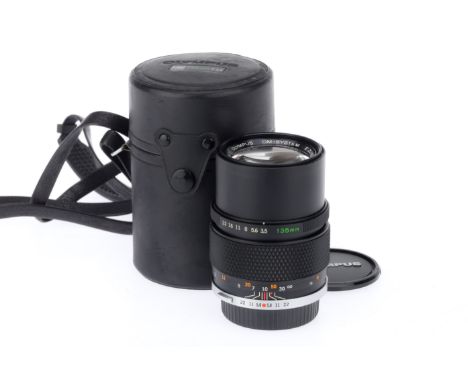 An Olympus Zuiko Auto-T f/3.5 135mm Lens, black, serial number 362527, body VG, optics VG, very light haze, with caps.