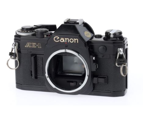 A Canon AE-1 35mm Camera Body, black, serial number 2925272, body VG, shutter works, meter responds to light, controls operat