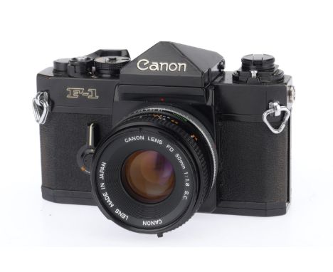 A Canon F-1 35mm SLR Camera, black, serial number 540883, body VG, shutter works, not battery tested, with a FD f/1.8 50mm le