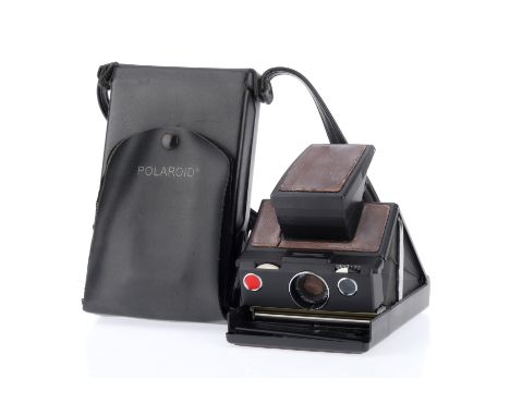 A Polaroid SX70 Instant Camera, brown, body P, some whitening to leatherette, cracks leatherette on top, to a small spring in