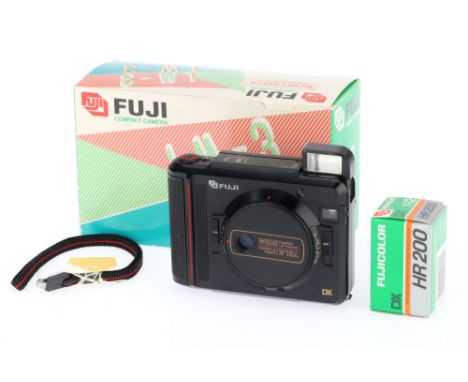 A Fuji TW-3 Tele Wide Twin Lens Half Frame Camera, black, serial number 8087753, body VG, clean inside, lens mechanism operat