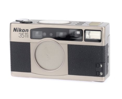 A Nikon 35 Ti 35mm Compact Camera, titanium grey, serial number US4018040, body, minor marks to lens cover and rear, usage ma