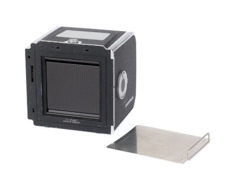 A Hasselblad Cine Film Camera Back, black, serial number UU314807, body G, takes 70mm film, two canisters are in the item.