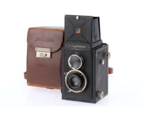 A Voigtlander Brillant TLR Camera, black, body G, viewfinder clear, shutter works but slow at 1 second, taking optics F-G wit