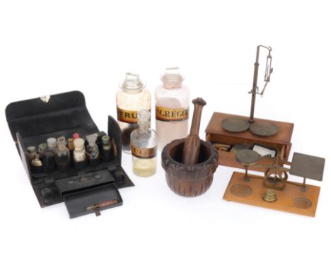 A Collection of Apothecary Chemists items, including a German medicine chest finished in black leather with various bottles, 