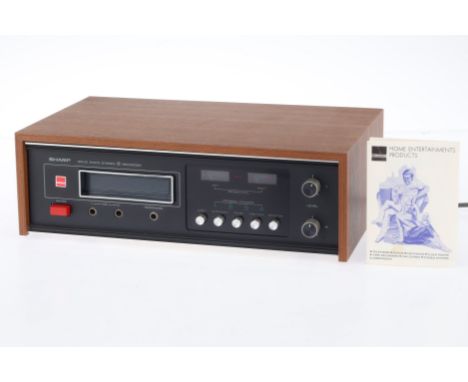 A Sharp Solid State Stereo 8 Recorder, brown, appears to power on when an 8 track cartridge is inserted (not supplied), no in