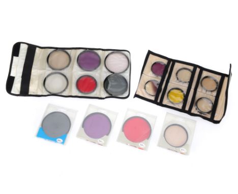 A Collection of Camera Lens Filters, comprising a set of six 52mm filters in a soft case, a set of mostly 72mm filters in a s