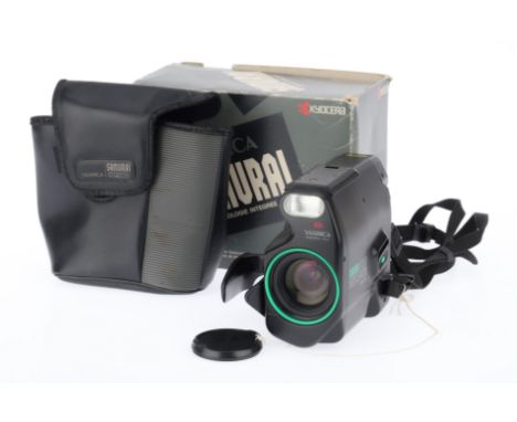A Yashica Kyocera Samurai X3.0 Half Frame Automatic Camera, black with green trim, serial number 220785, body G, no eyecup, b