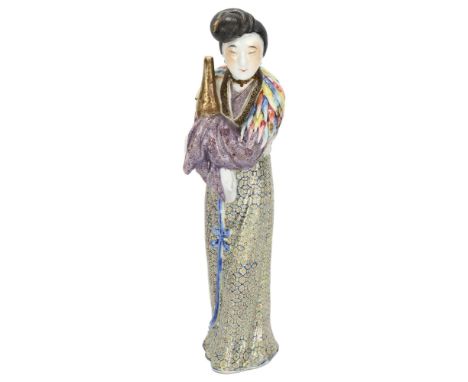 A 19th century Chinese porcelain figure with fine enamel decoration, height 25cmSome small breaks to feather cape, areas of o