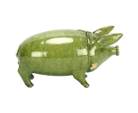 A Rye Pottery green glaze Sussex pig, with detachable head, inscribed "Wunt Be Druv", incised mark inside head, length 16cmIn
