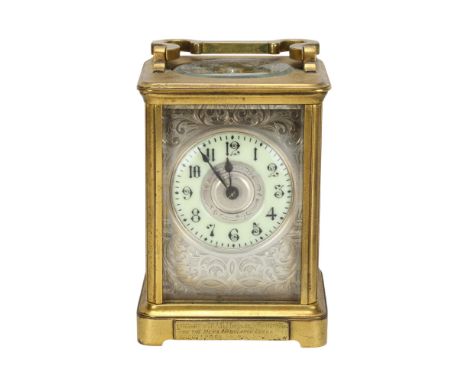 A 19th century brass-cased carriage clock, foliate engraved silvered dial with enamel chapter ring and presentation plaque "P