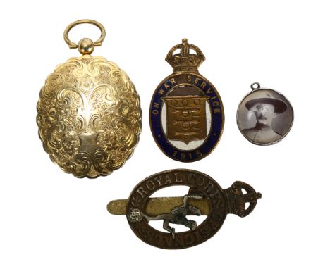 A Royal Corps of Signals cap badge, and 1915 Ordnance badge, together with 2 pendants with related photos 