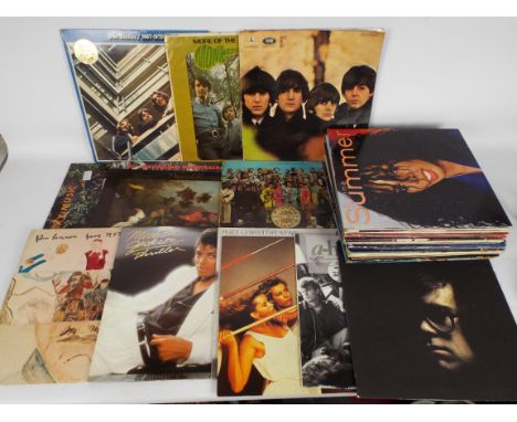 A collection of 12" vinyl records to include The Monkees, The Beatles, Roxy Music, 10cc, Procol Harum, John Lennon, Michael J