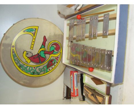 A Xylophone, together with a bodhran drum and harmonica