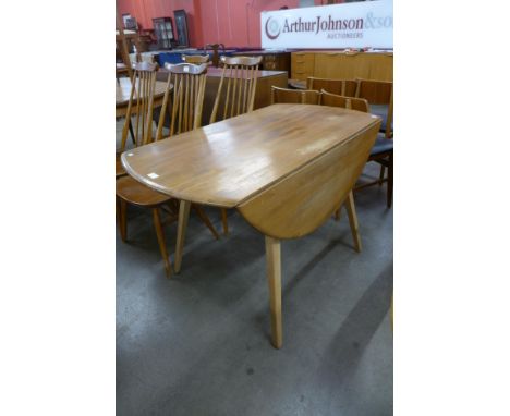 An Ercol Blonde elm and beech Windsor drop-leaf table 
