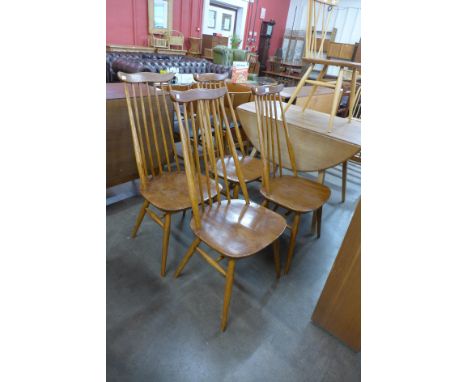 A set of four Ercol elm and beech Goldsmith chairs 