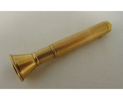 A 9ct gold cigar piercer, engine turned cylindrical form, approx total weight 9g
