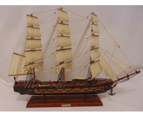 A model of a three mast galleon with linen sails on rectangular stand with the label Fragata Espanola ano 1780, 57.5 x 82 x 1