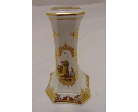 A Meissen taper stick holder of faceted rectangular form decorated with panels of ships on the coast and gilded geometric for