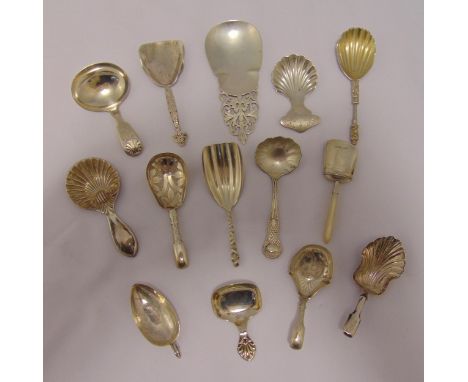 Fourteen silver and white metal caddy spoons of various shape and form, approx total weight 186g