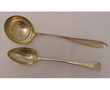 A George III hallmarked silver basting spoon, Old English pattern, London 1803 by Henry Lias and a white metal soup ladle, ap