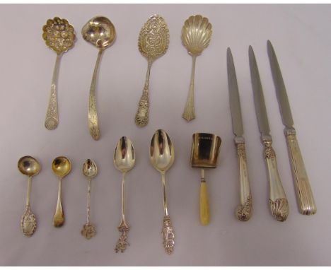 Three silver handled letter openers, an Irish George III  bright cut cream ladle, Dublin 1800 and nine various silver and whi