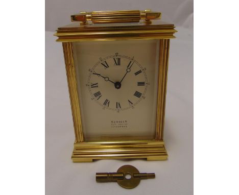 Sewells of Liverpool gilded metal carriage clock of customary form, white enamel dial and Roman numerals, to include key, 13 