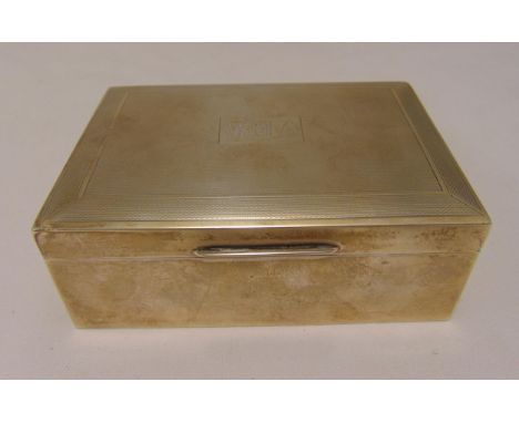 A hallmarked silver engine turned rectangular cigarette box, Birmingham 1960