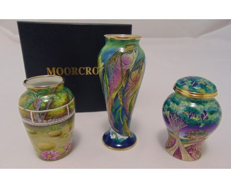 Two Moorcroft miniature enamel vases and a covered vase, decorated with fish, trees and vegetation, tallest 10.5cm (h) to inc