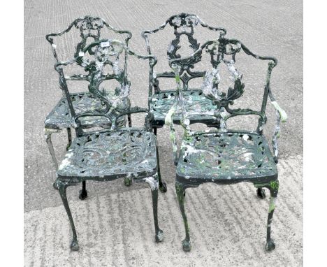 A set of four green painted pierce metal garden chairs, 84cm high