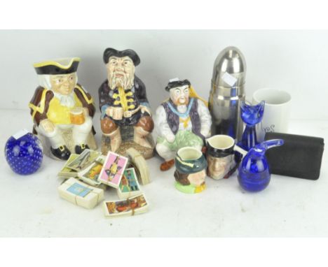 Assorted collectable's, to include ceramic Toby Jugs, a novelty cigarette dispenser in the form of a military shell, cigarett
