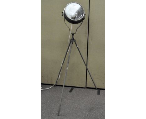 A large industrial floor standing show spot light, on tripod stand, previously from the Bath &amp; West Showground, 162cm hig
