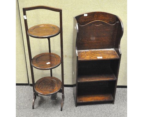 An oak shelf/magazine rack, three tiered, 76cm high, together with a vintage folding cake stand