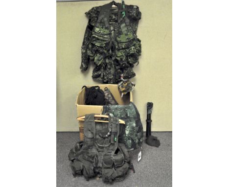 A box of Army surplus style camouflage clothing and accessories